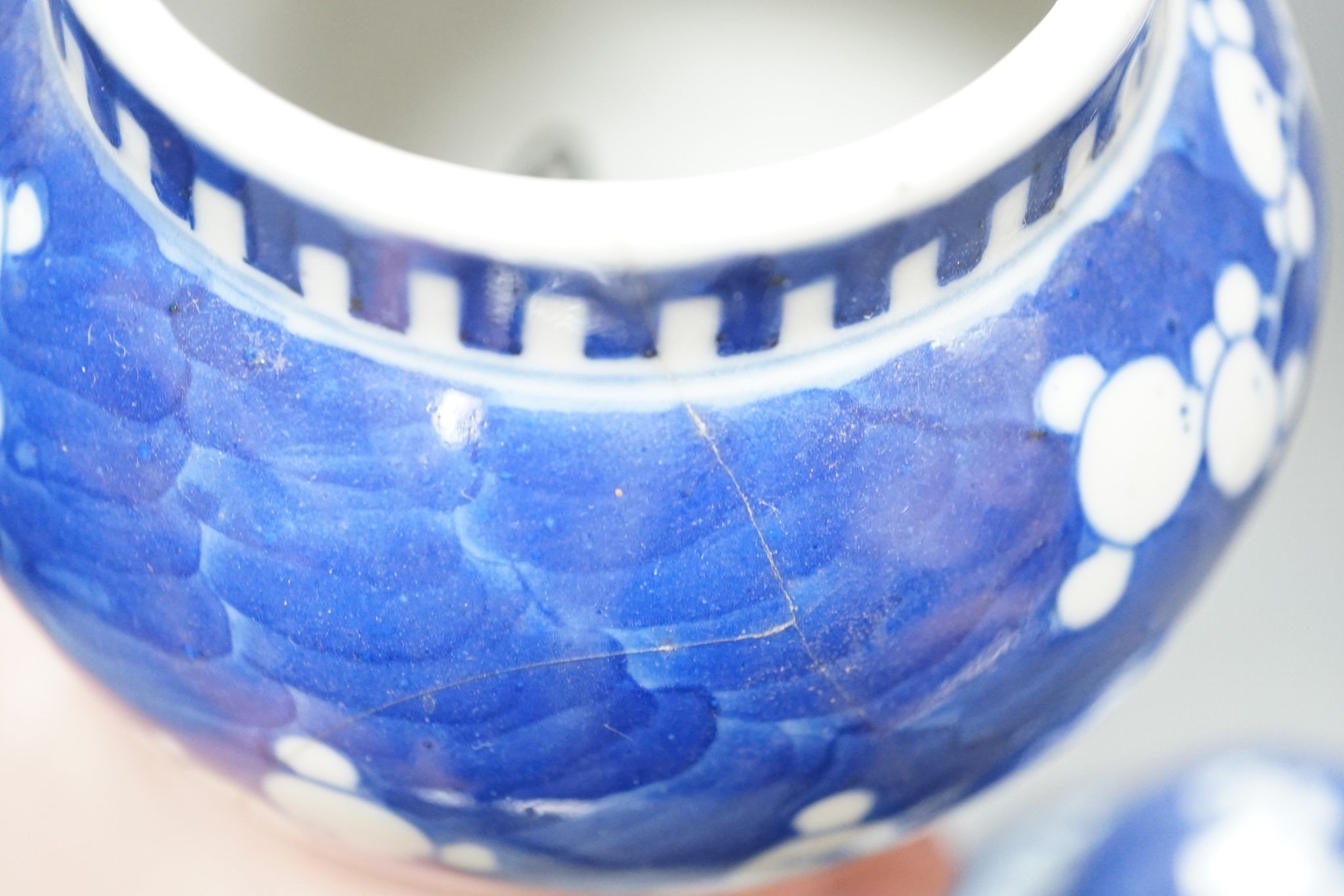 Three Chinese blue and white prunus decorated jars and covers, 19th/20th century, with four character marks 18cm